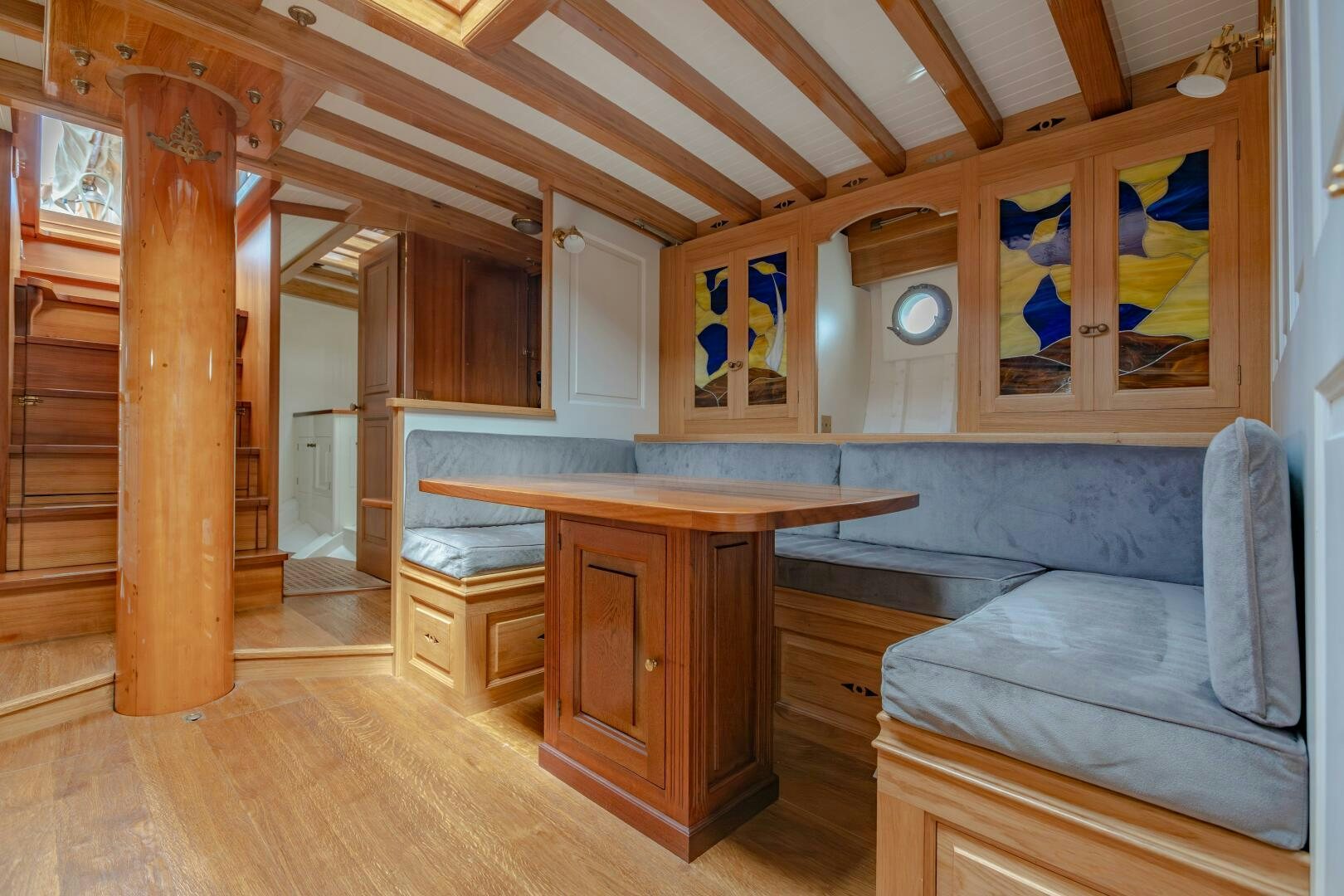 a room with a couch and a table aboard ARMIDE Yacht for Sale
