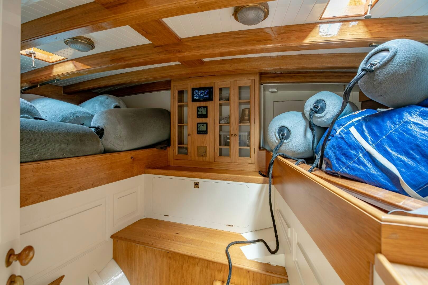 a room with bunk beds and a couple of beds aboard ARMIDE Yacht for Sale