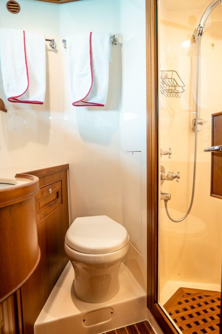 a bathroom with a toilet and a sink aboard QUARRY Yacht for Sale