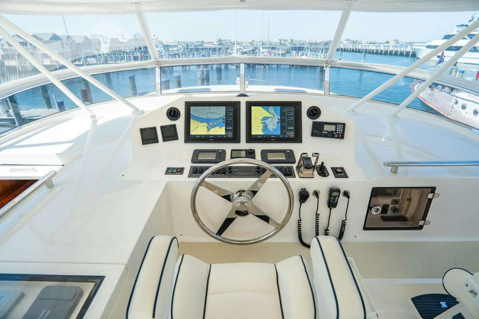 a white ship with a compass aboard QUARRY Yacht for Sale