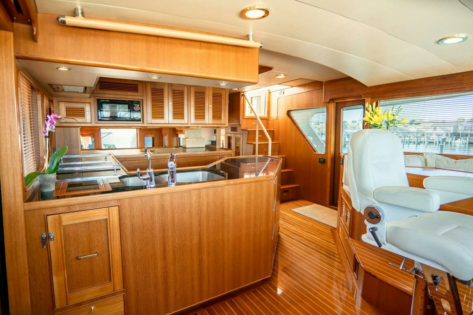 a kitchen with wooden cabinets aboard QUARRY Yacht for Sale
