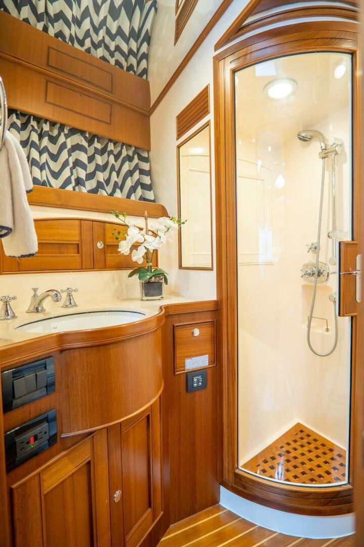 a bathroom with a sink and a mirror aboard QUARRY Yacht for Sale