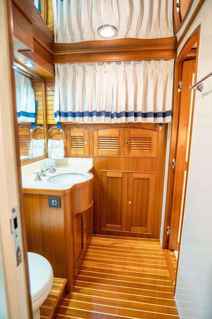 a bathroom with a sink and a toilet aboard QUARRY Yacht for Sale
