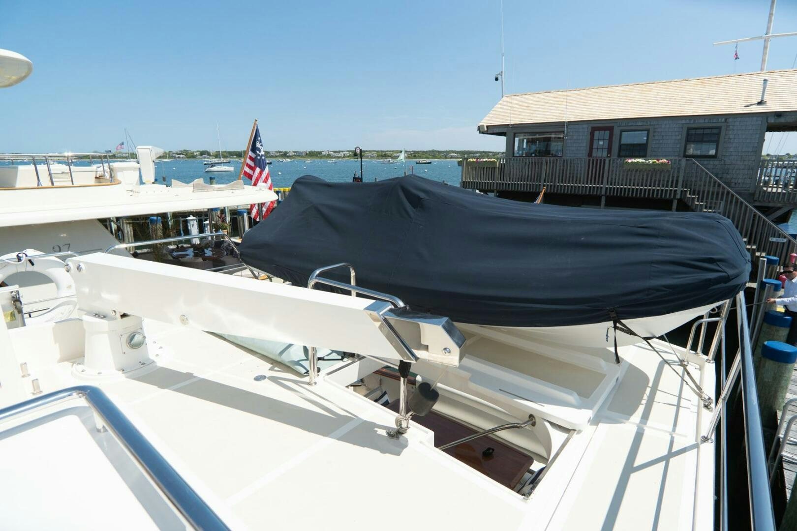 a boat with a flag on the deck aboard QUARRY Yacht for Sale