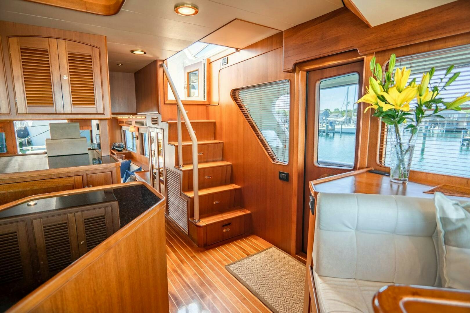 a kitchen with a staircase and a plant in the middle aboard QUARRY Yacht for Sale