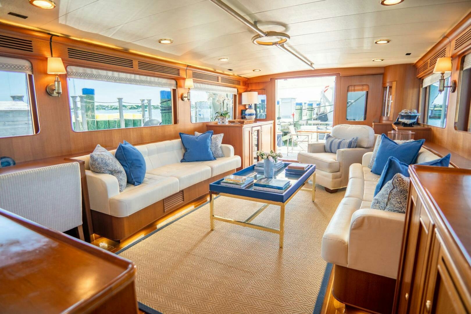 a living room with a couch and a table aboard QUARRY Yacht for Sale