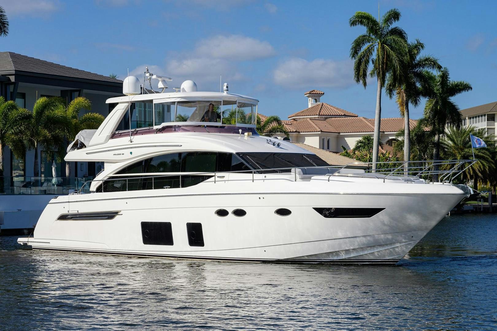 a white yacht in the water aboard KHATCH YOU LATER Yacht for Sale
