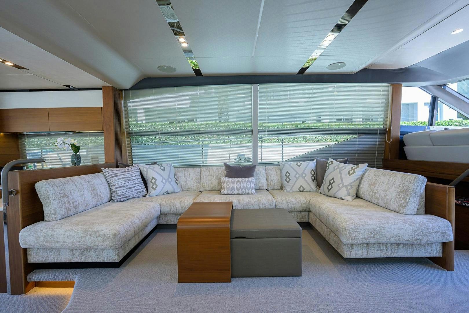 a living room with a large window aboard KHATCH YOU LATER Yacht for Sale