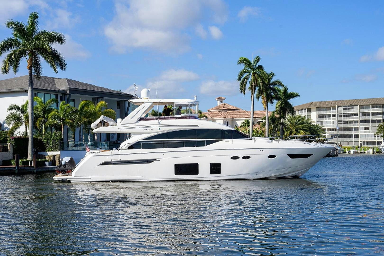 a white yacht in the water aboard KHATCH YOU LATER Yacht for Sale