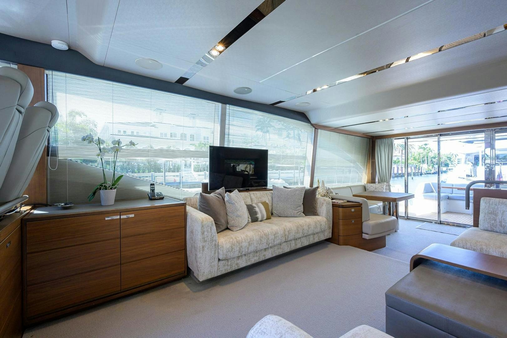 a living room with a large window aboard KHATCH YOU LATER Yacht for Sale