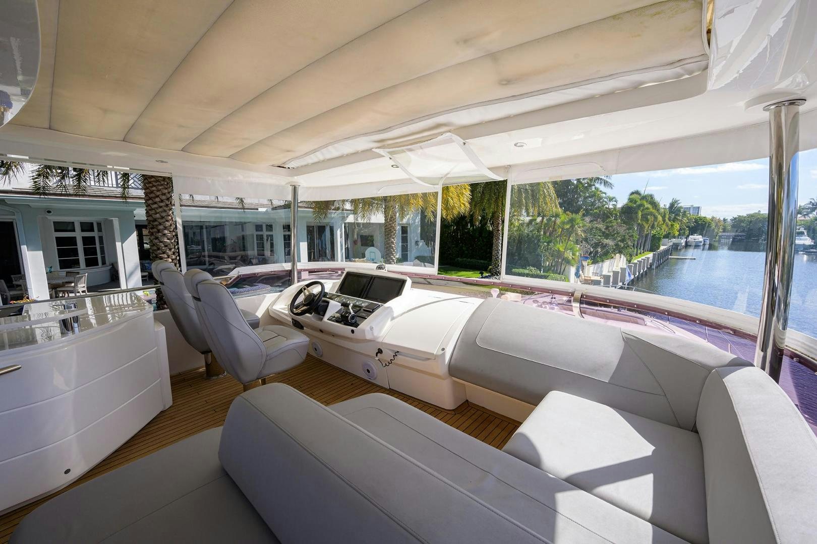 a room with a couch and a table and chairs aboard KHATCH YOU LATER Yacht for Sale