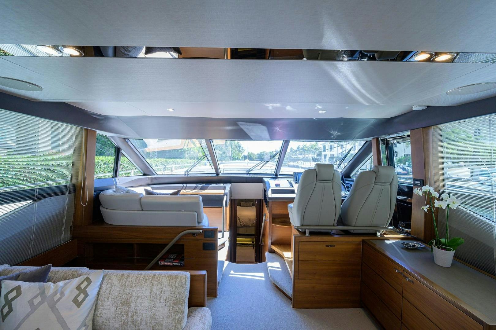 inside of a room with a large window and a table with chairs aboard KHATCH YOU LATER Yacht for Sale