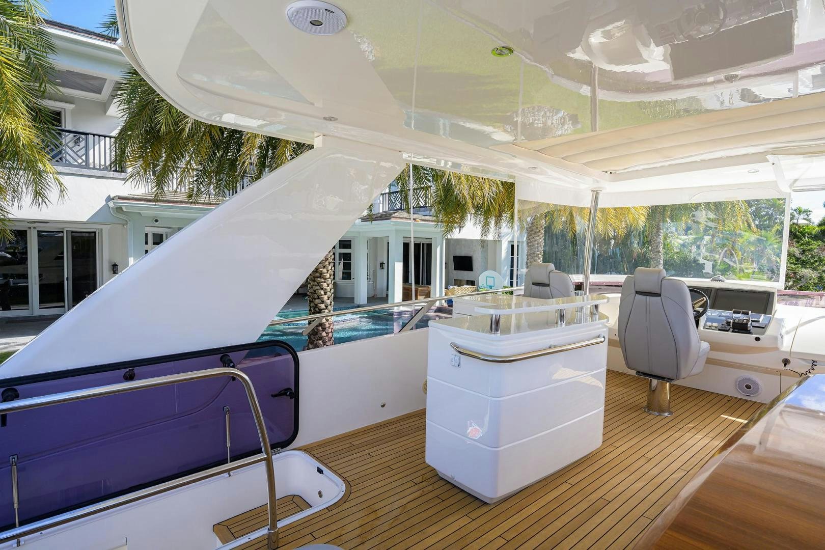 a large white tent with a deck and chairs aboard KHATCH YOU LATER Yacht for Sale