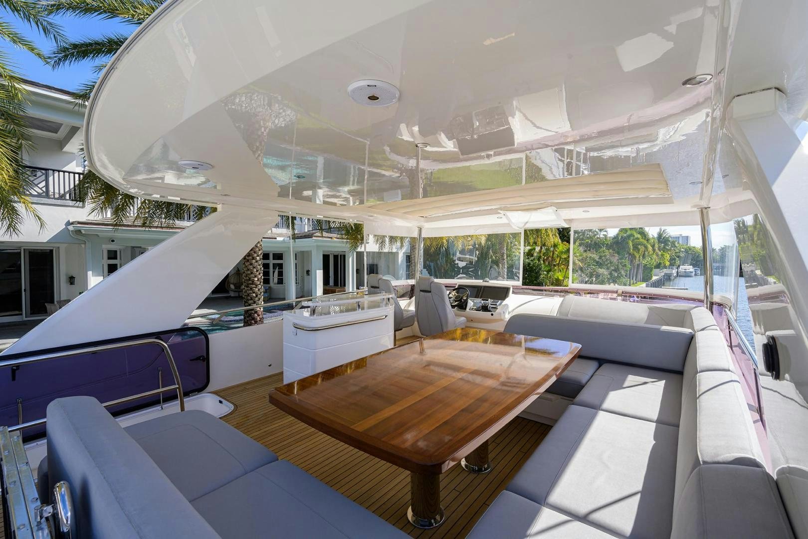 a large white tent with a table and chairs aboard KHATCH YOU LATER Yacht for Sale