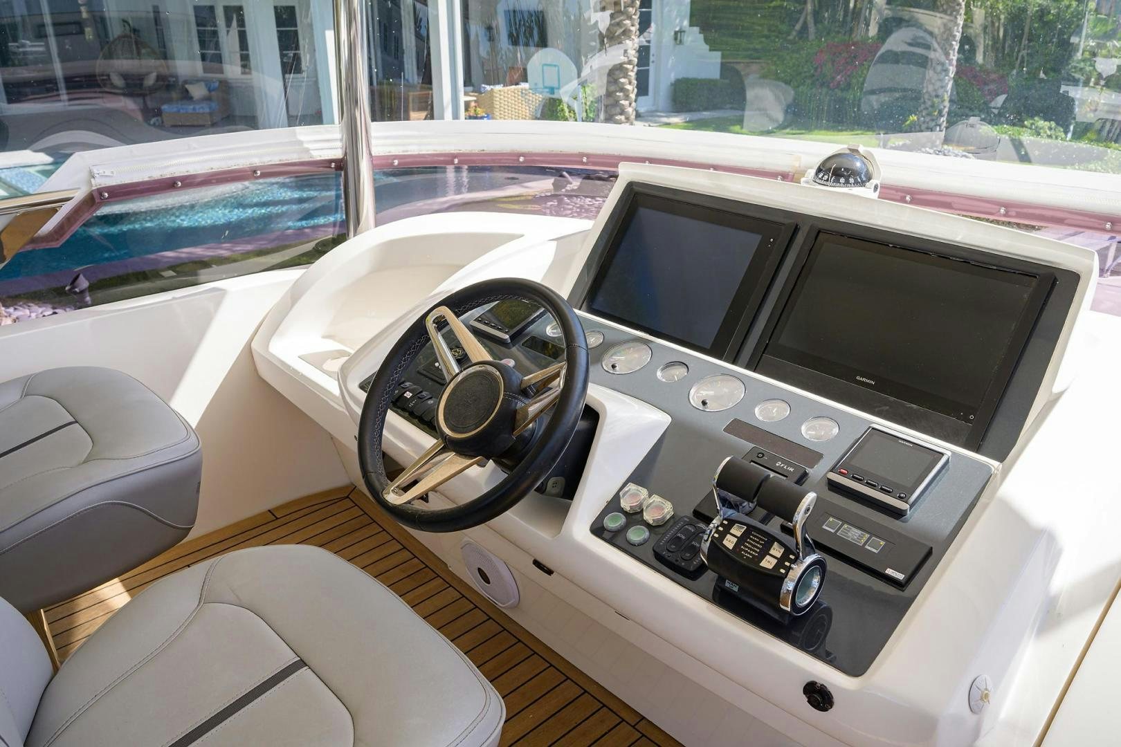 a car with a screen and steering wheel aboard KHATCH YOU LATER Yacht for Sale