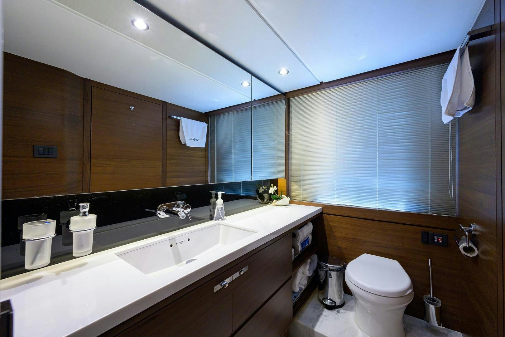 a bathroom with a toilet and a sink aboard KHATCH YOU LATER Yacht for Sale