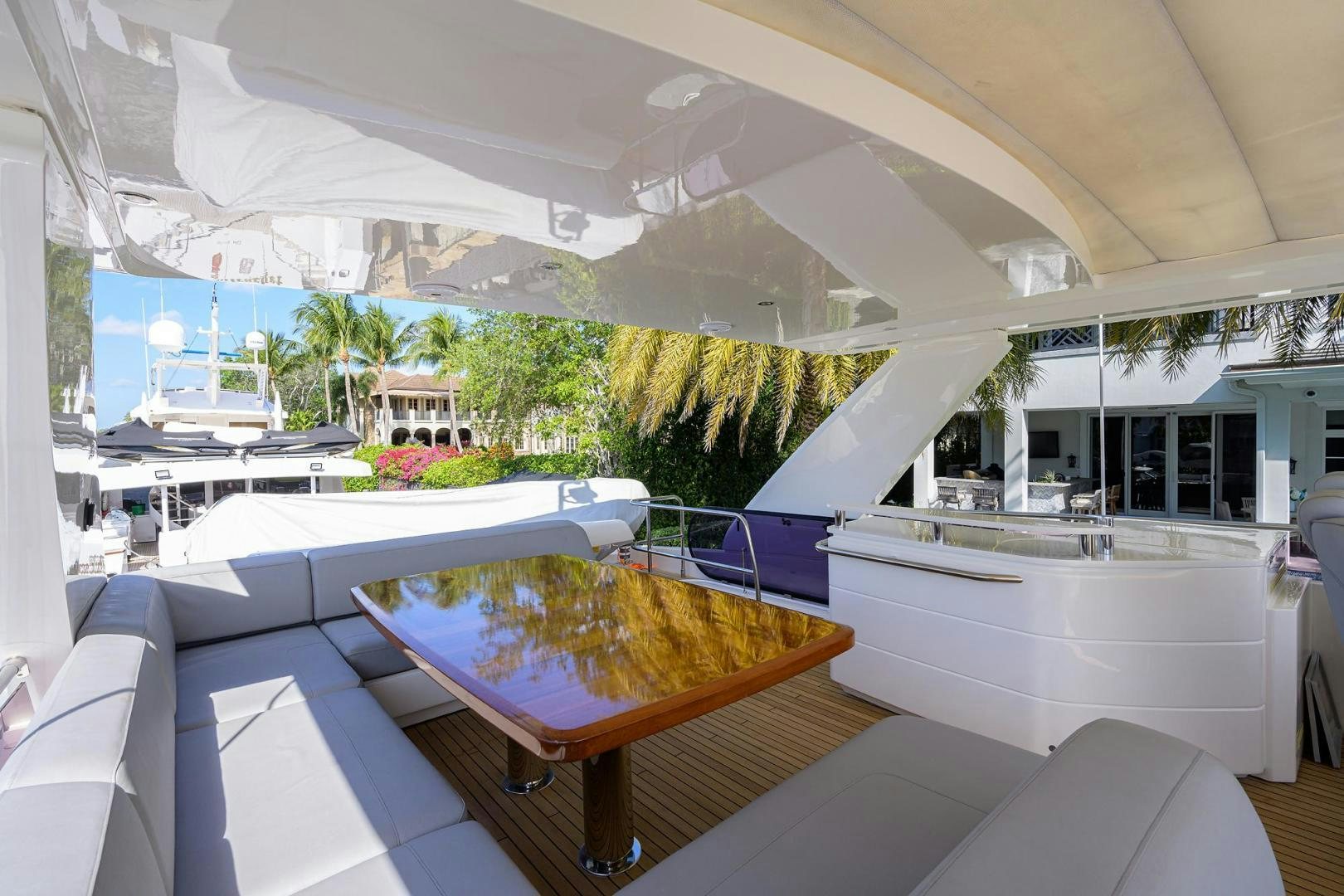 a room with a pool table and chairs aboard KHATCH YOU LATER Yacht for Sale