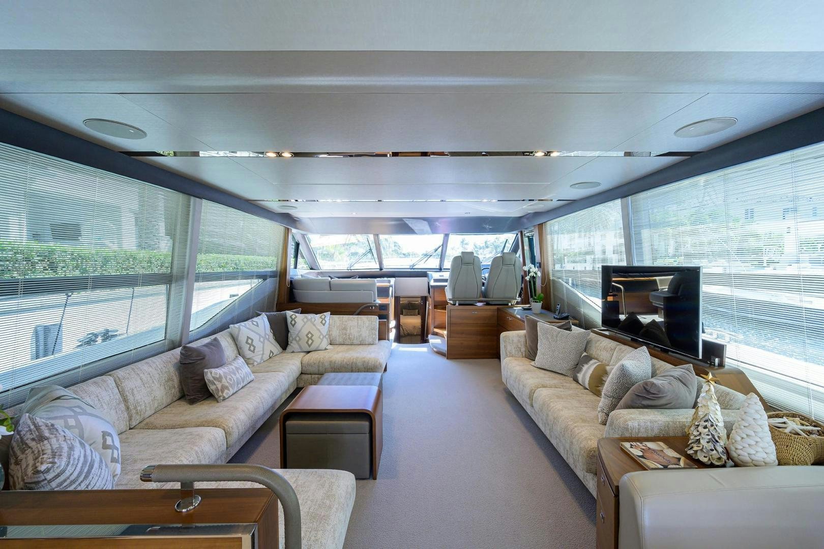 a living room with a large window aboard KHATCH YOU LATER Yacht for Sale