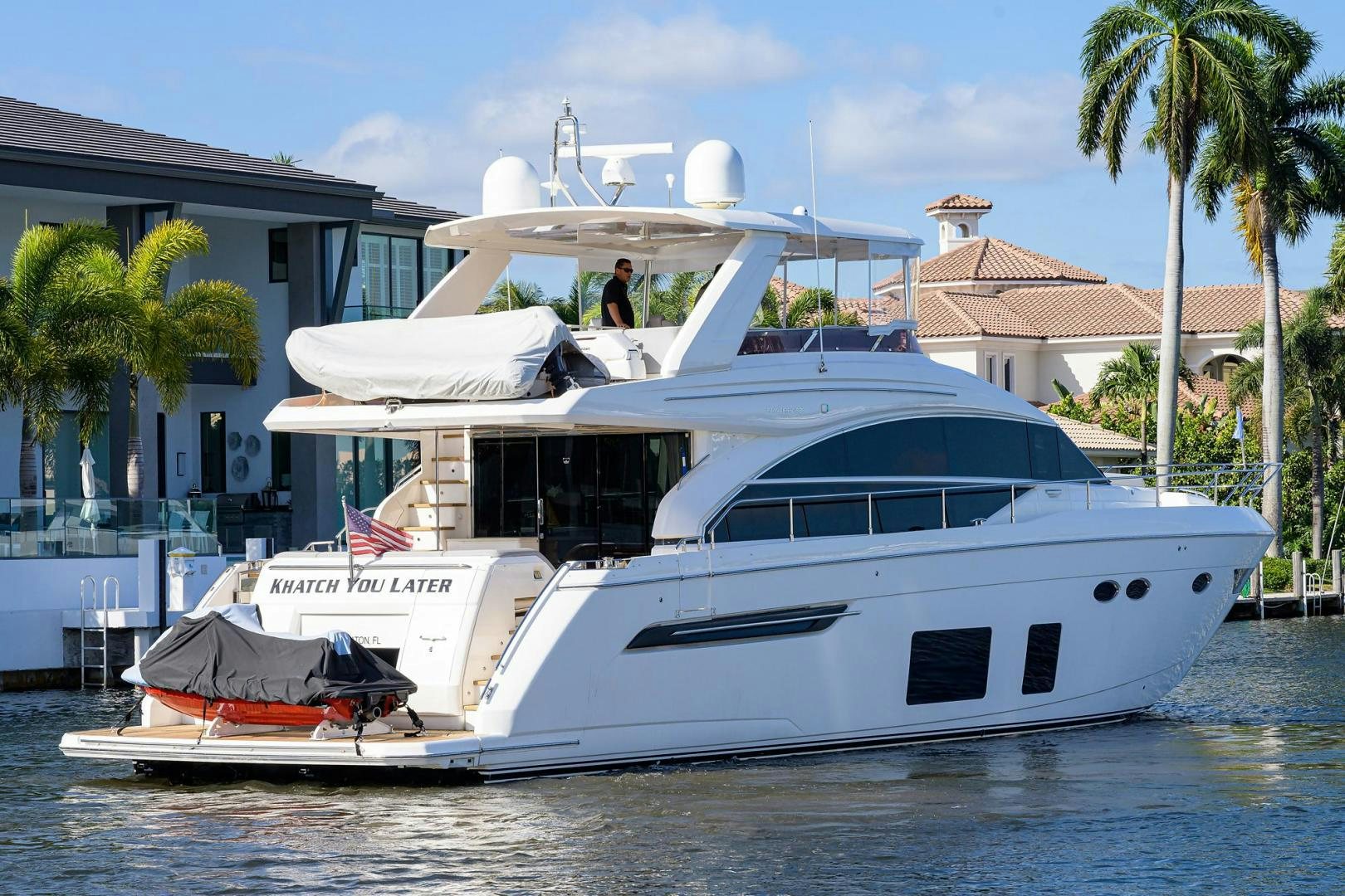 a white yacht in the water aboard KHATCH YOU LATER Yacht for Sale