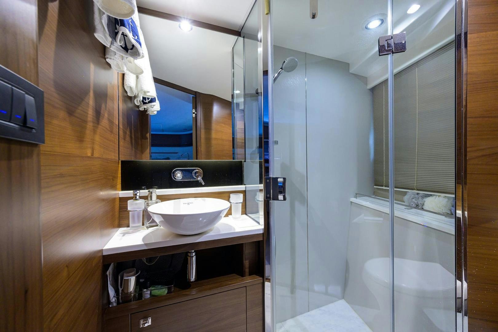 a bathroom with a sink and a shower aboard KHATCH YOU LATER Yacht for Sale
