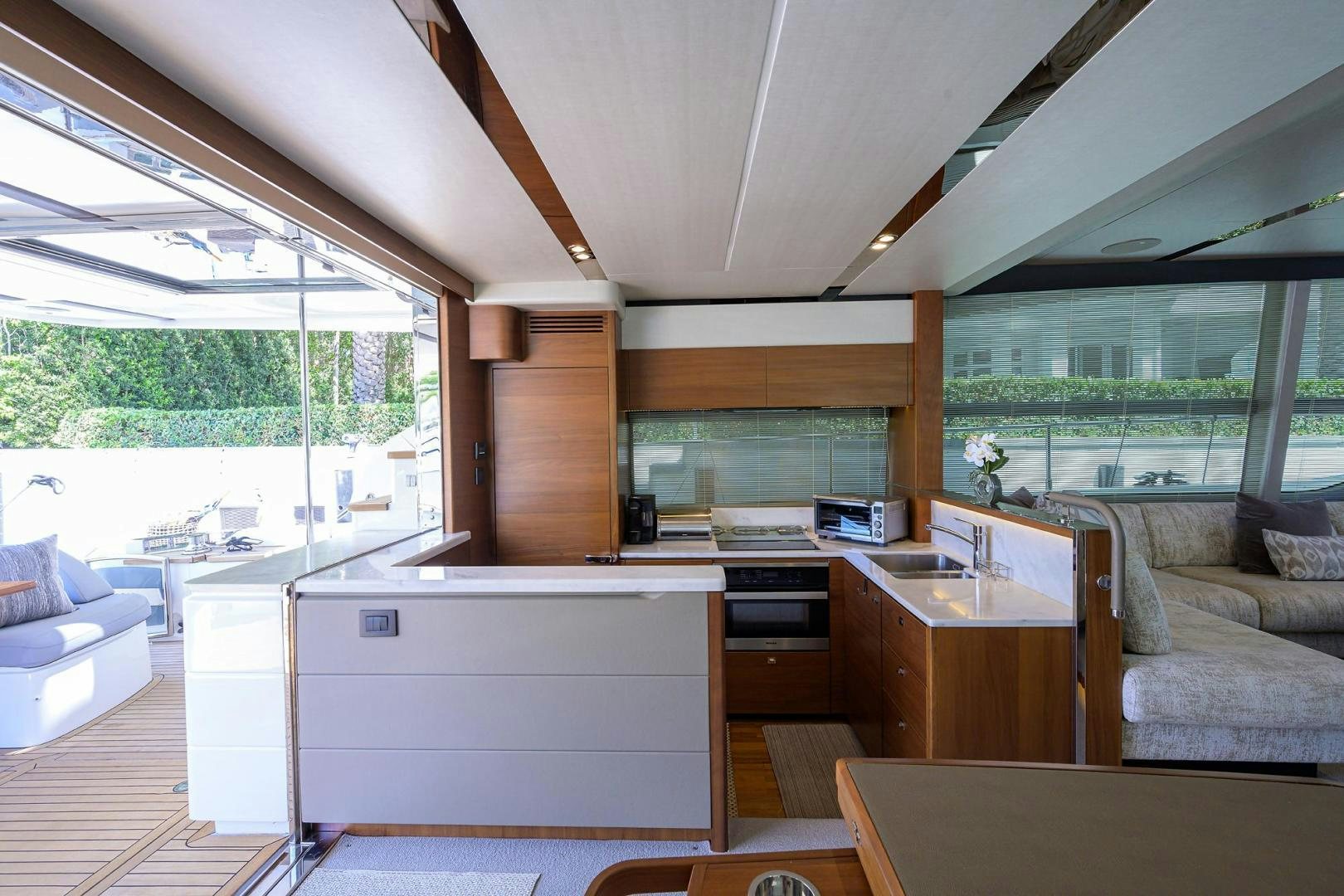 a kitchen with a large window aboard KHATCH YOU LATER Yacht for Sale