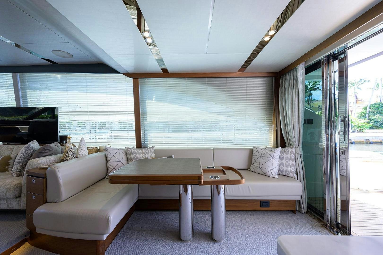 a living room with a couch and a table aboard KHATCH YOU LATER Yacht for Sale