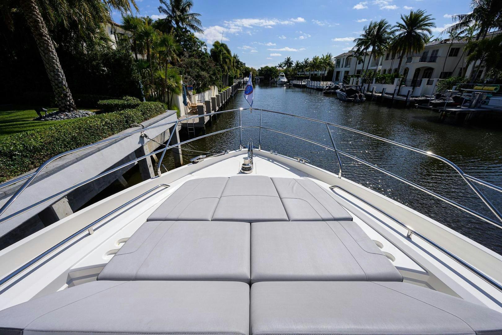 a long white boat on a dock aboard KHATCH YOU LATER Yacht for Sale