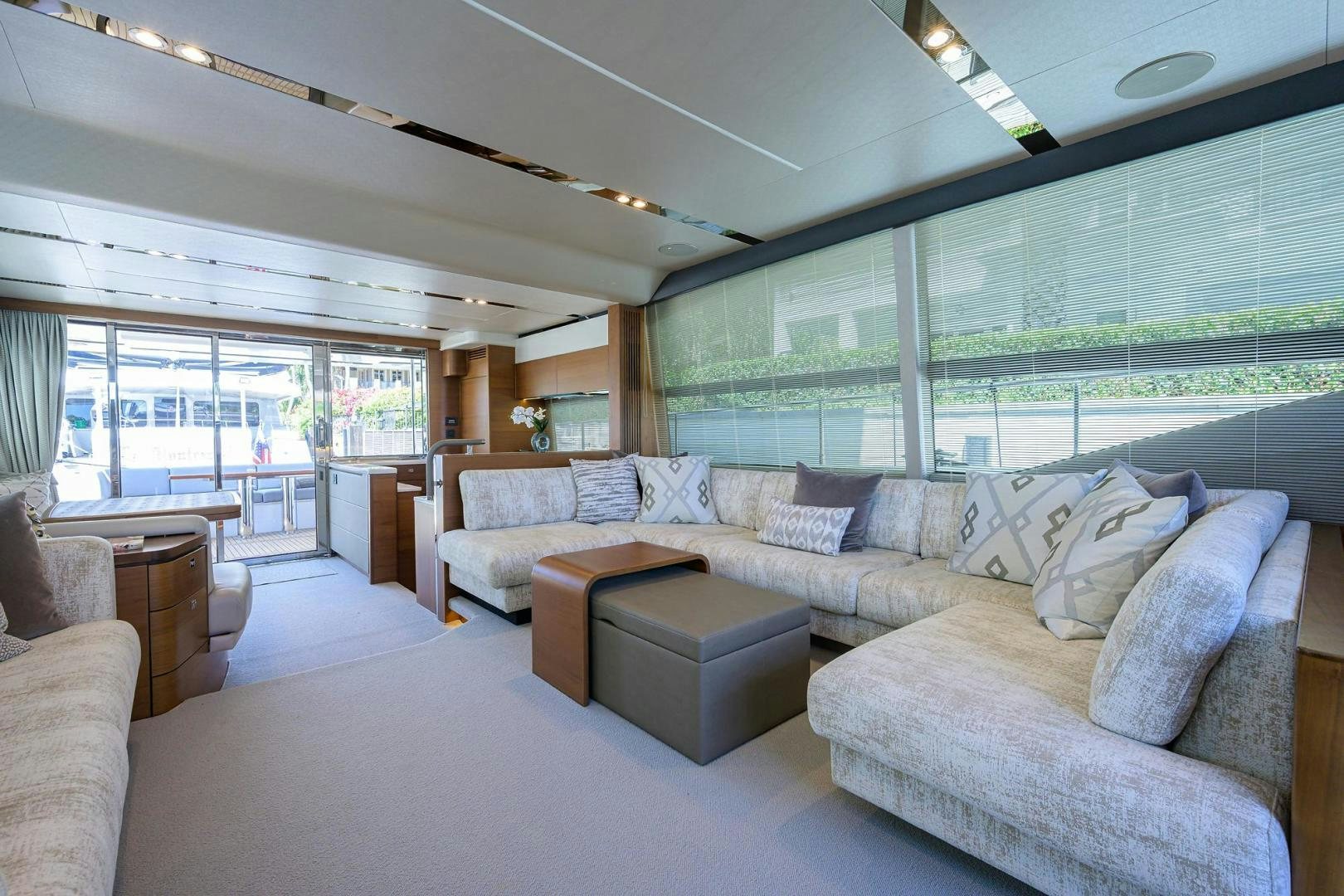 a living room with a large window aboard KHATCH YOU LATER Yacht for Sale