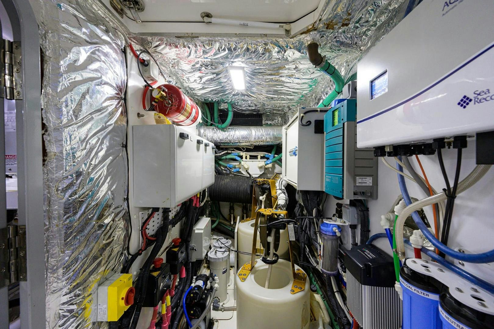 a room with machinery and pipes aboard KHATCH YOU LATER Yacht for Sale