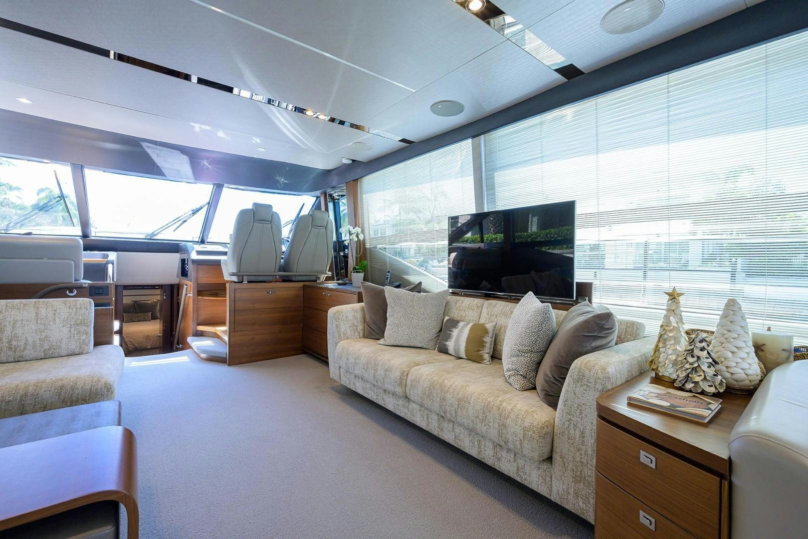 a living room with a large window aboard KHATCH YOU LATER Yacht for Sale