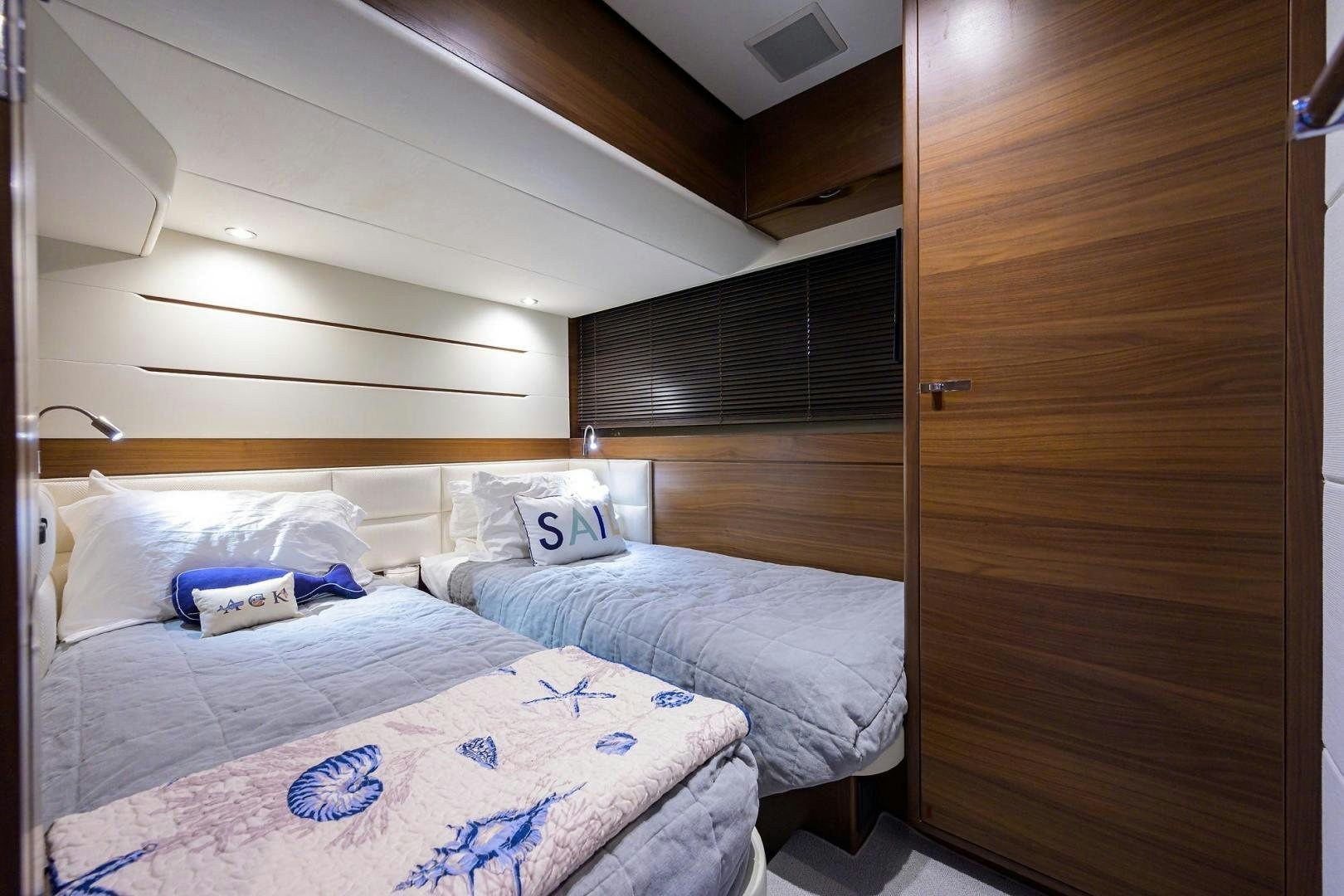 a room with two beds aboard KHATCH YOU LATER Yacht for Sale