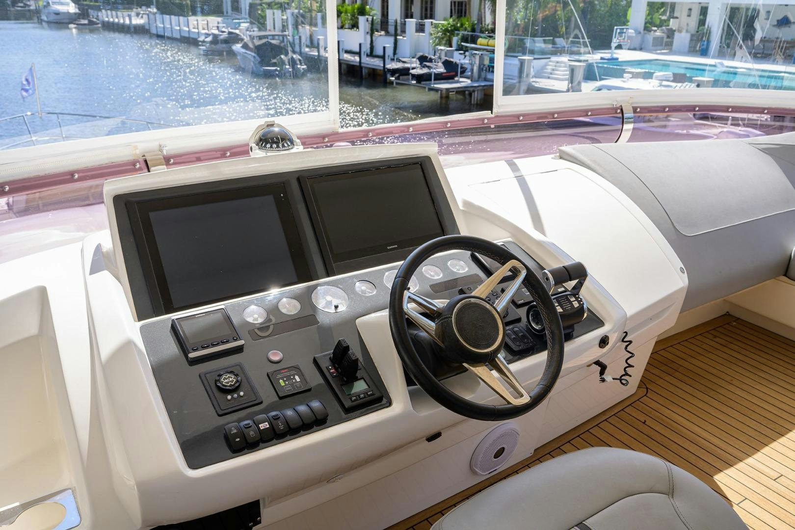 a car with a screen and a steering wheel aboard KHATCH YOU LATER Yacht for Sale