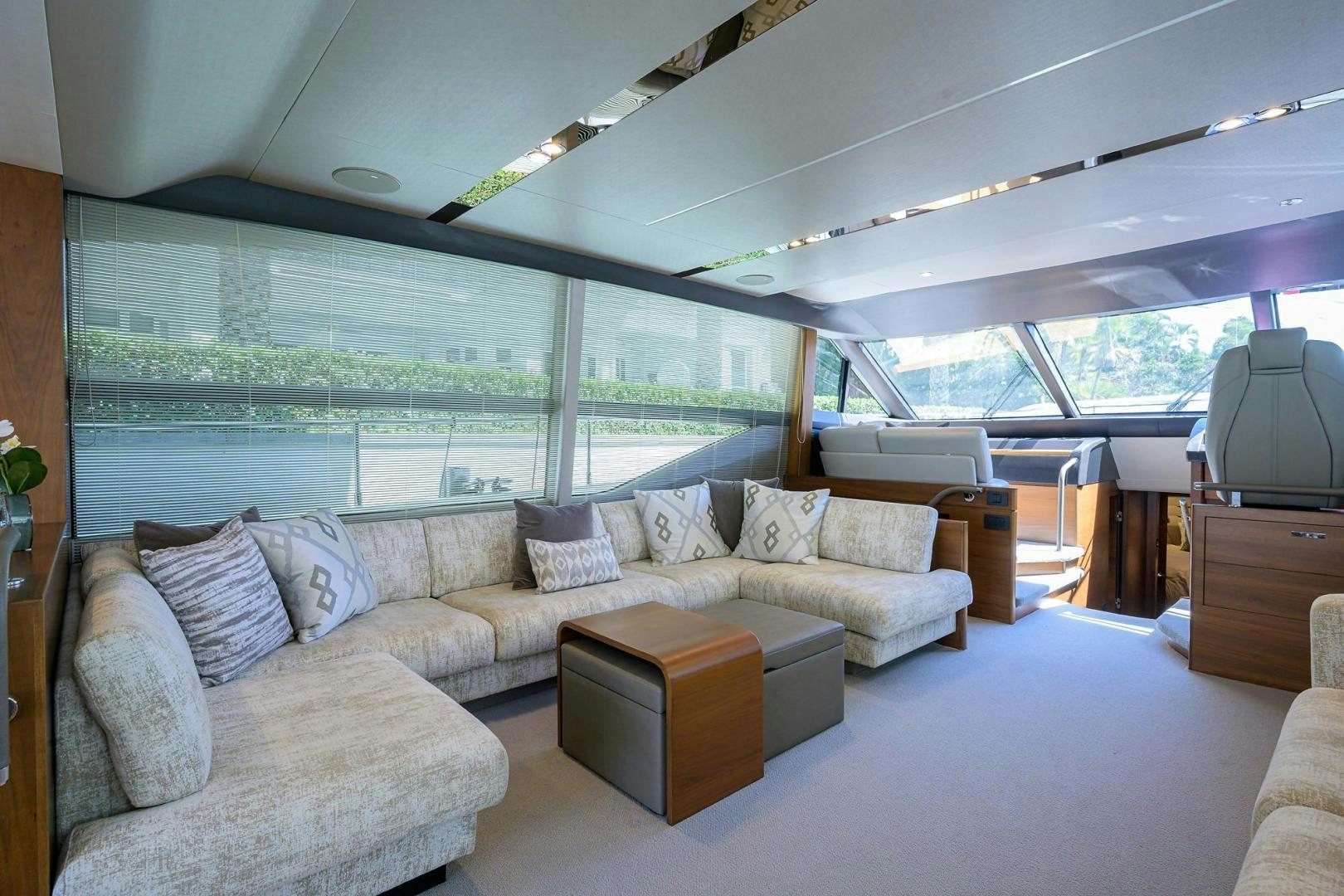 a living room with a large window aboard KHATCH YOU LATER Yacht for Sale