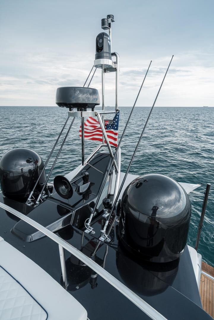 a boat with a flag on the front aboard BEL SOGNO Yacht for Sale