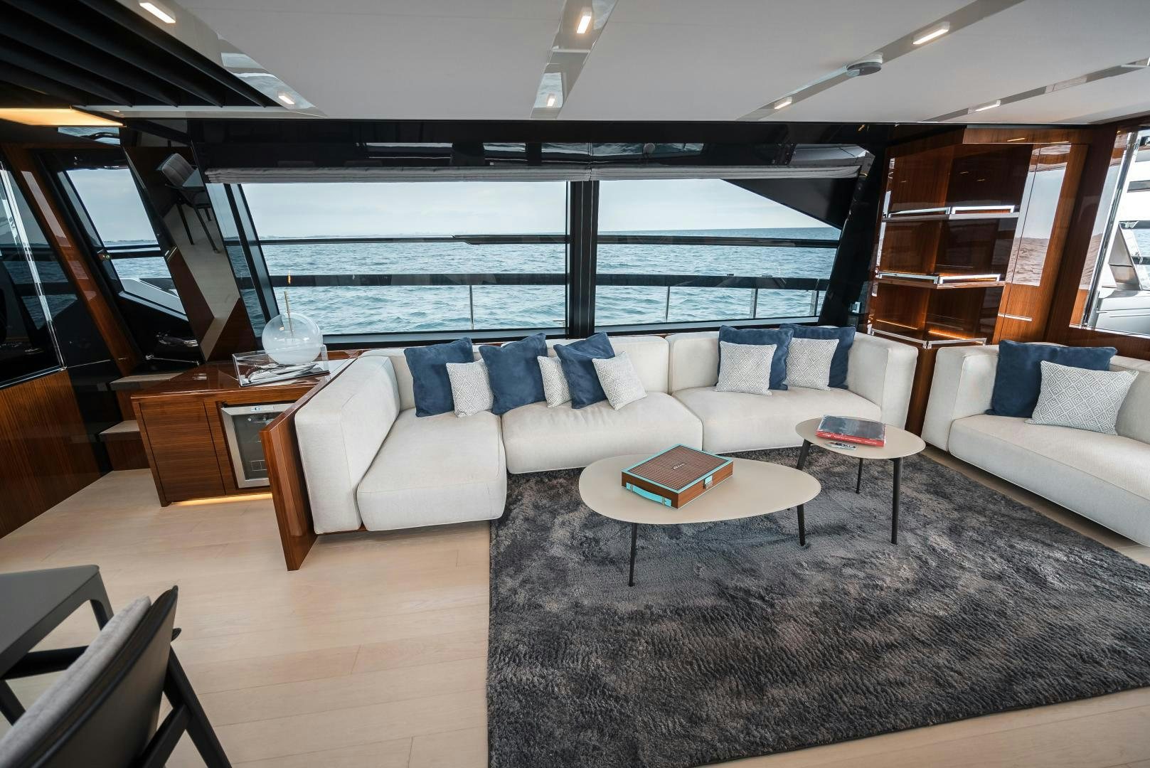 a living room with a large window aboard BEL SOGNO Yacht for Sale