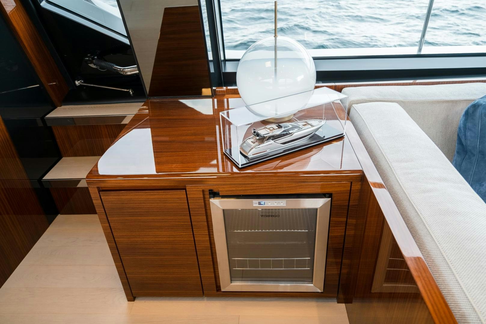 a table with a lamp and a book on it aboard BEL SOGNO Yacht for Sale