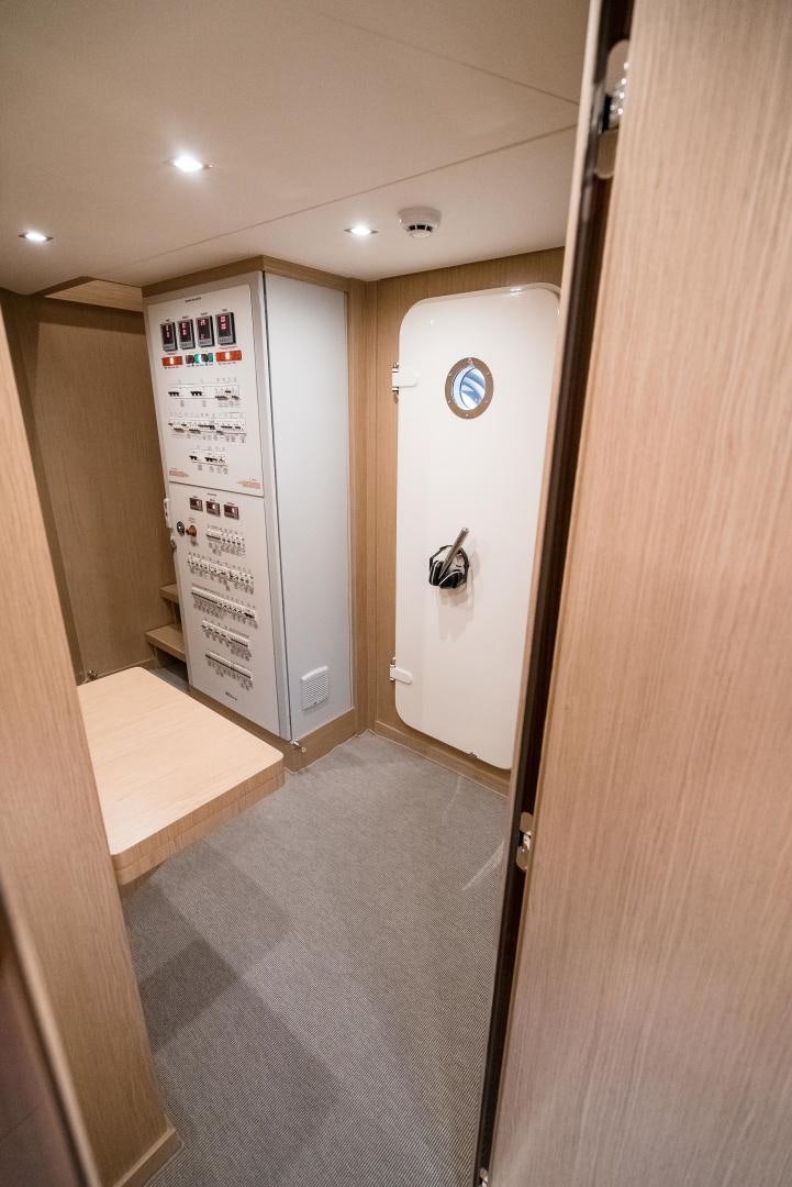 a hallway with a door and a mirror aboard BEL SOGNO Yacht for Sale