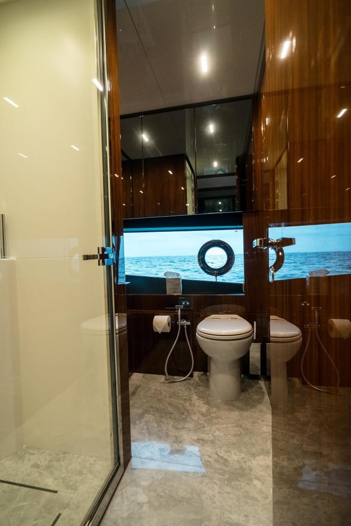 a bathroom with a large blue sign aboard BEL SOGNO Yacht for Sale