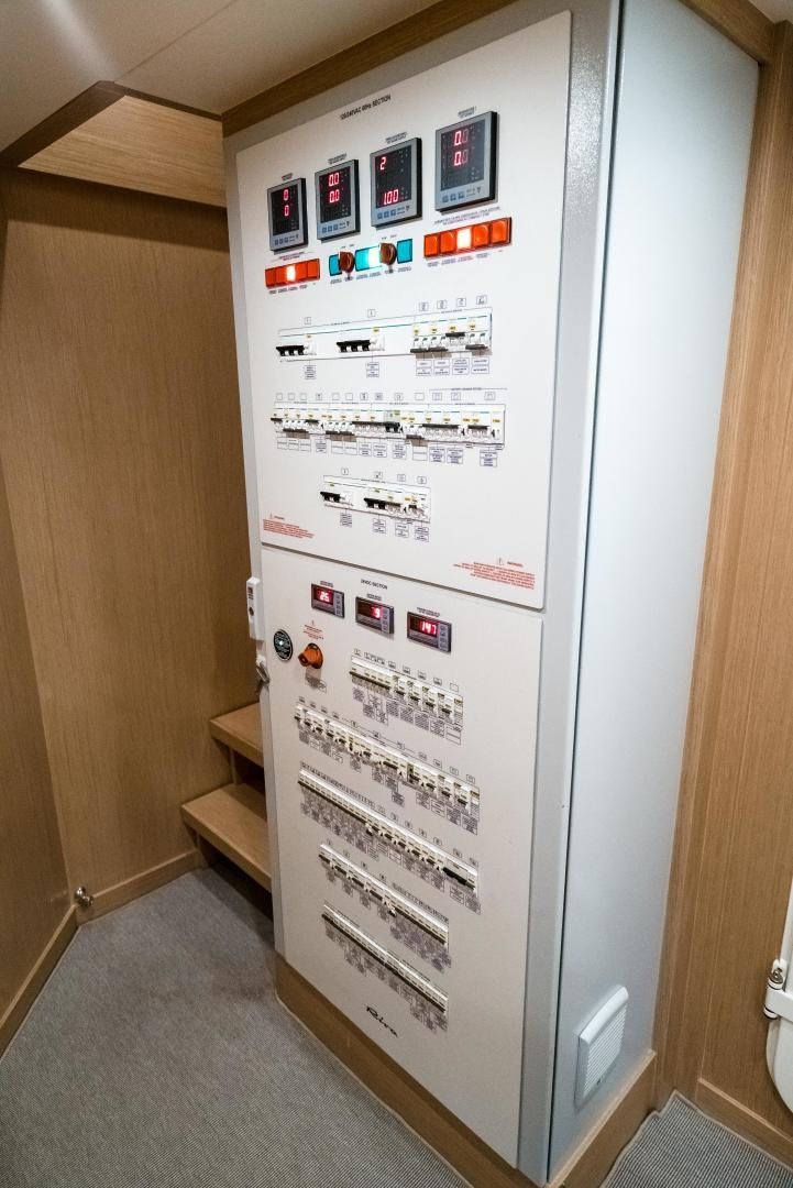 a white vending machine with stickers on it aboard BEL SOGNO Yacht for Sale