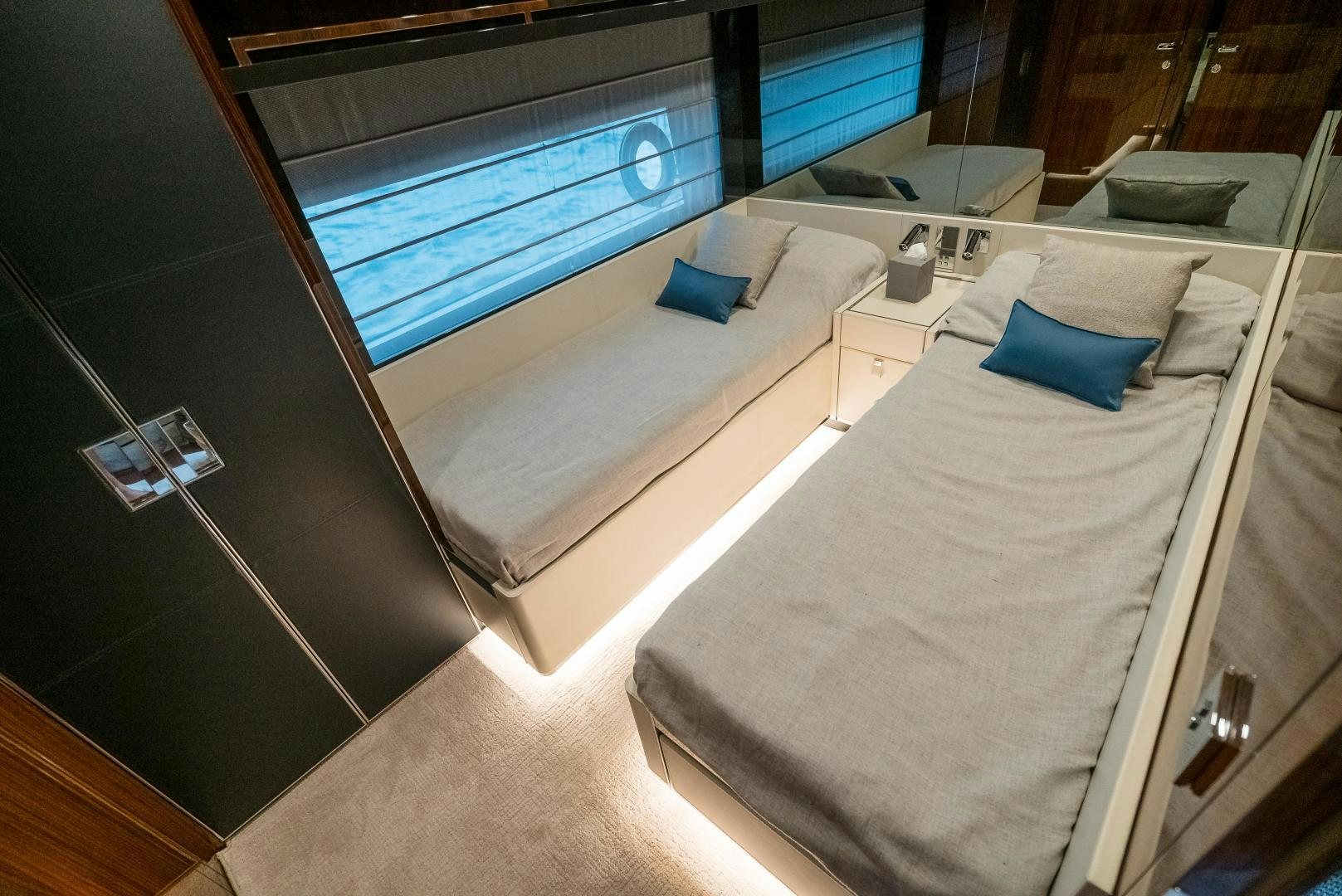 a room with a bed and a television aboard BEL SOGNO Yacht for Sale