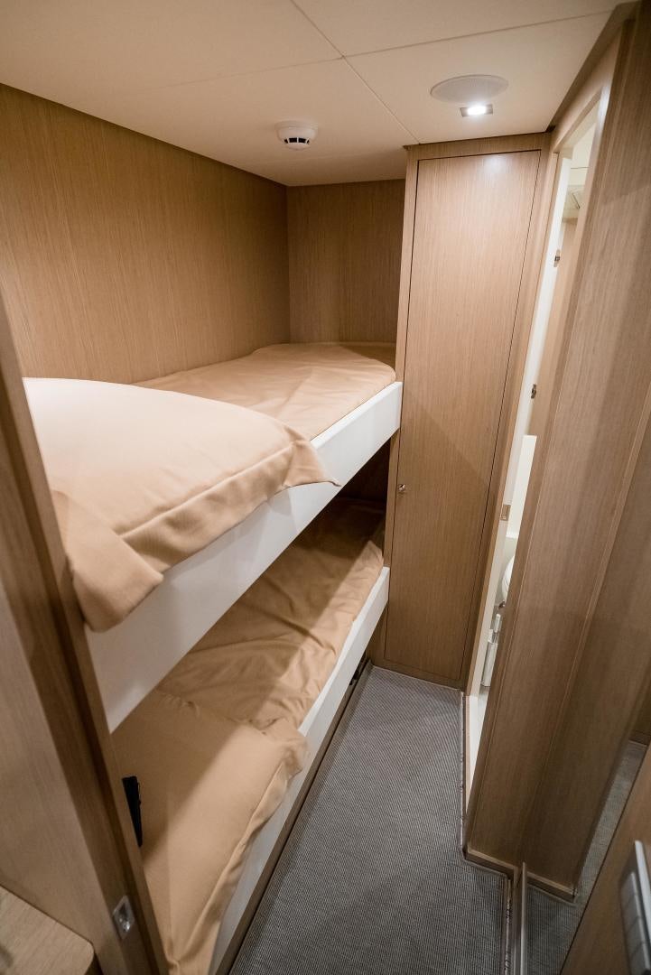 a room with a bed and a closet aboard BEL SOGNO Yacht for Sale
