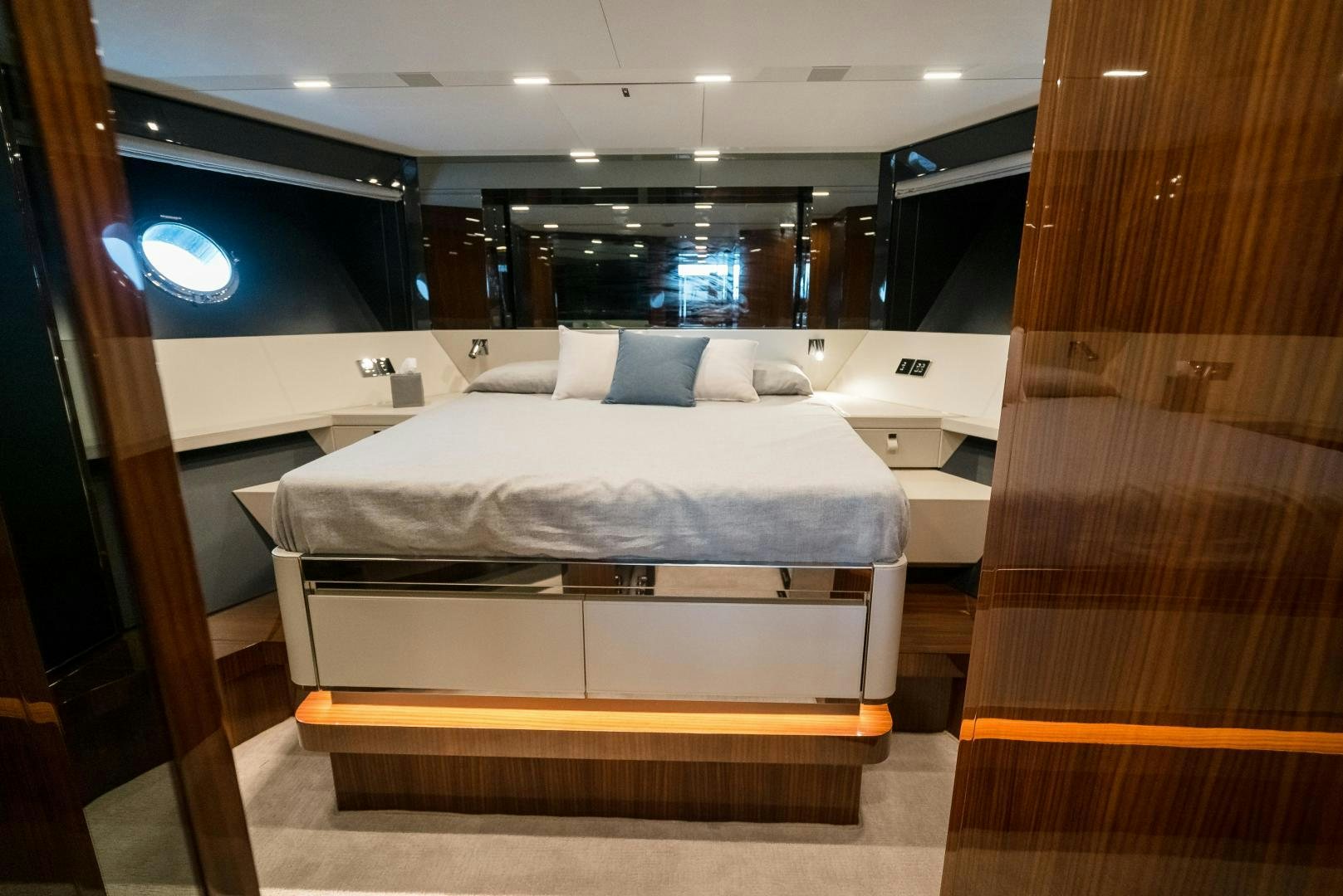 a room with a bed and a wood door aboard BEL SOGNO Yacht for Sale