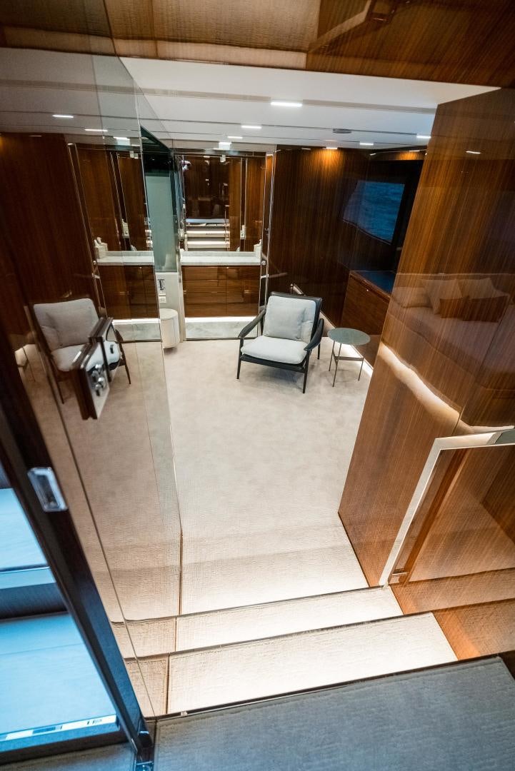 a room with a chair and a table and a couch aboard BEL SOGNO Yacht for Sale