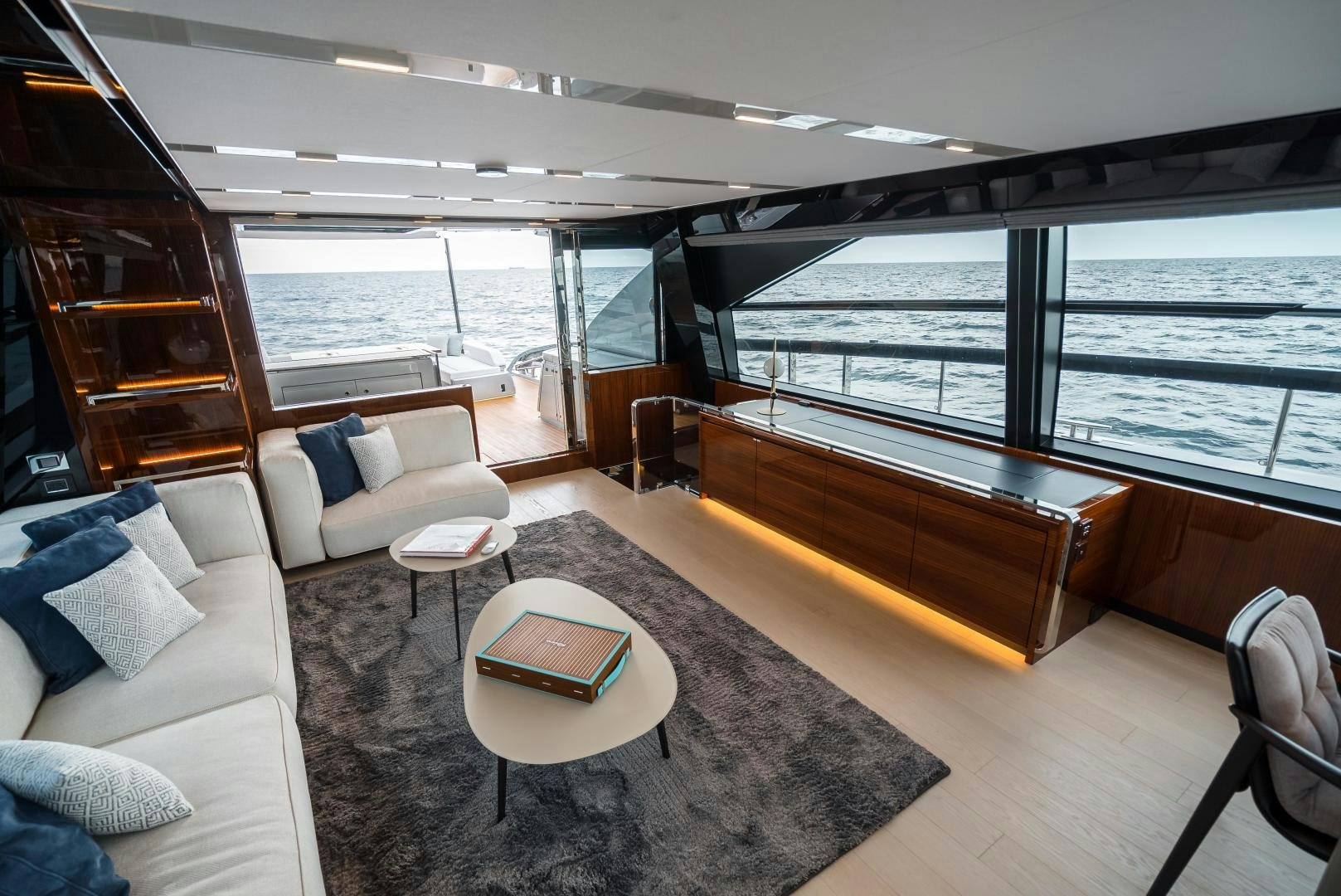 a living room with a large window aboard BEL SOGNO Yacht for Sale
