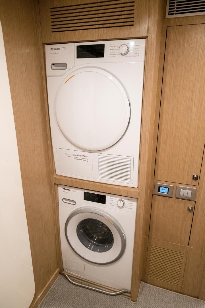 a washing machine in a closet aboard BEL SOGNO Yacht for Sale
