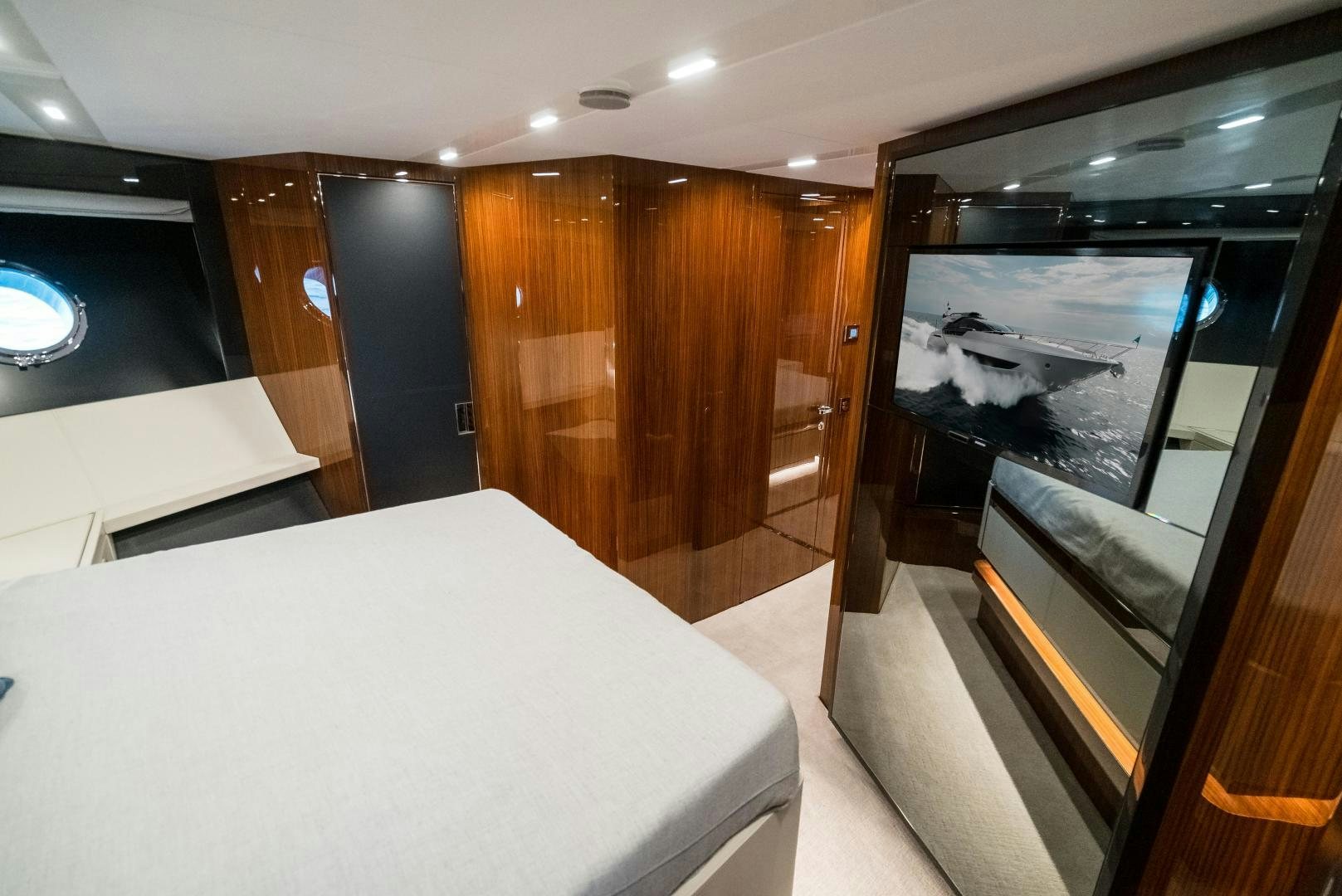 a room with a bed and a large window aboard BEL SOGNO Yacht for Sale