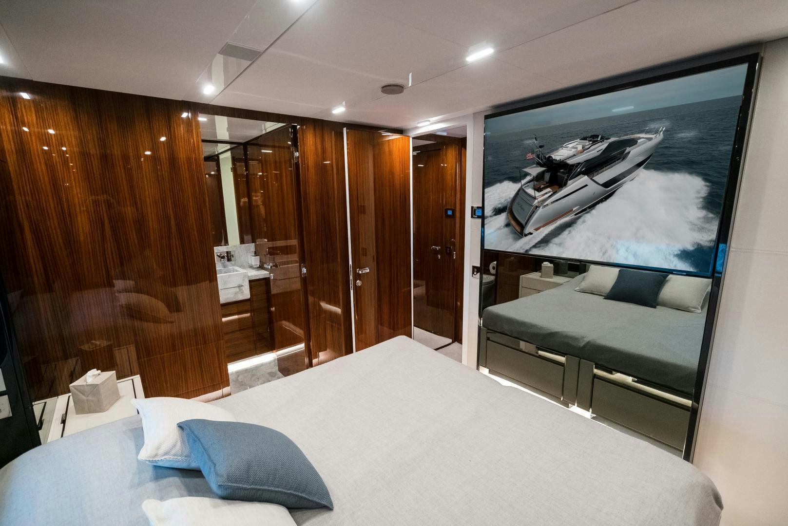 a room with a bed and a television aboard BEL SOGNO Yacht for Sale
