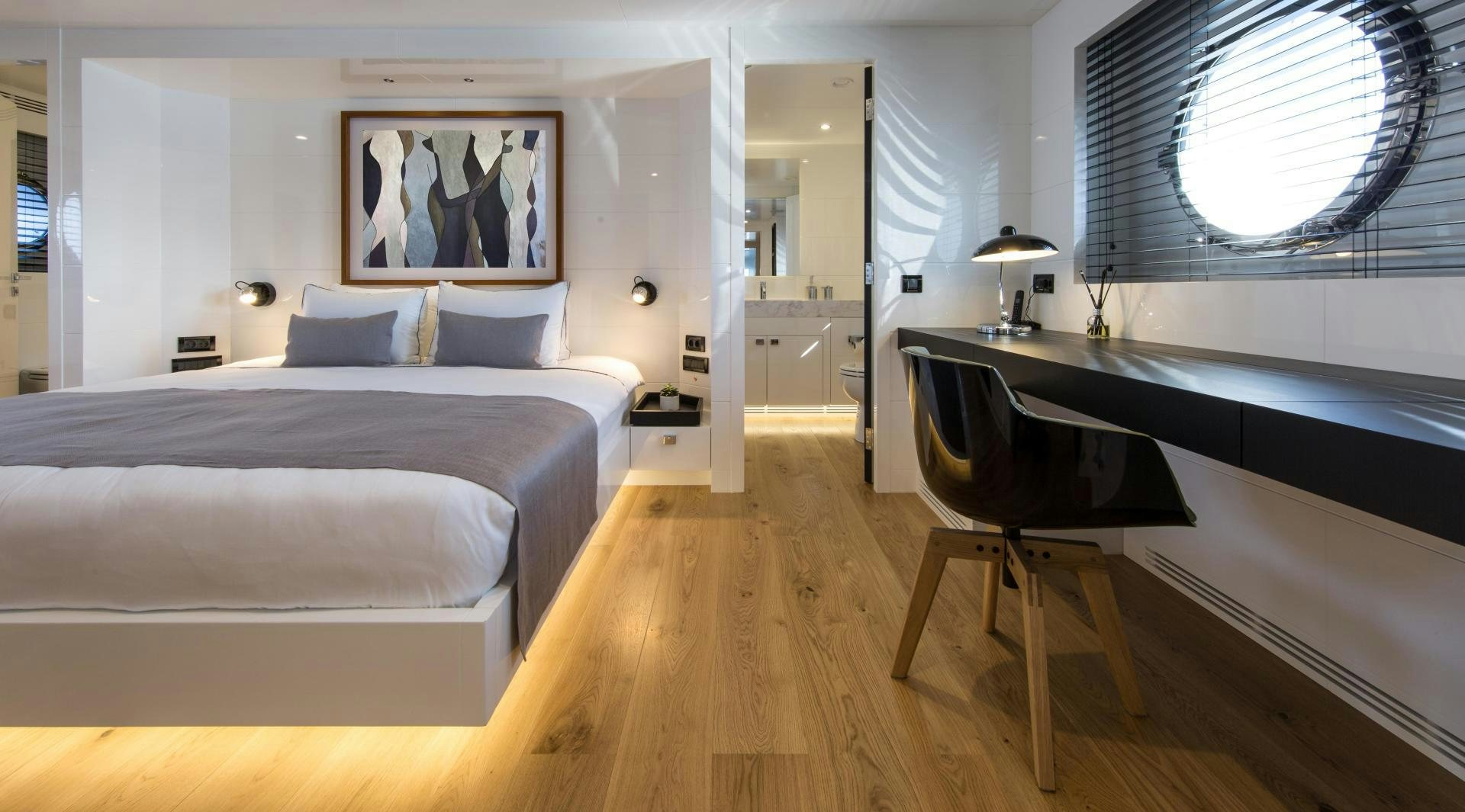 a room with a bed and a desk aboard HEKATE, P372 Yacht for Sale