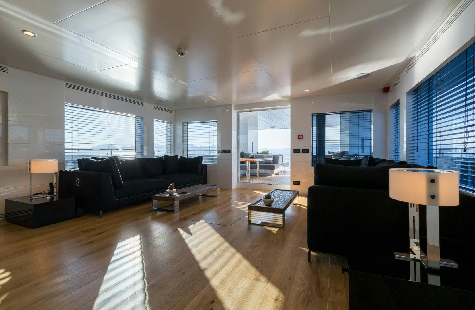 a living room with a wood floor aboard HEKATE, P372 Yacht for Sale
