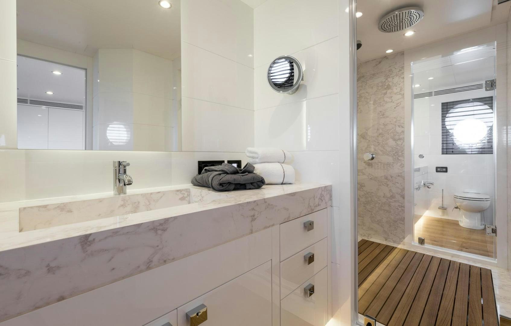 a bathroom with a large mirror aboard HEKATE, P372 Yacht for Sale